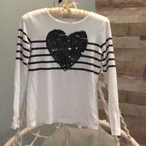Girls White long sleeve shirt with black strips and a black Sequin hart.